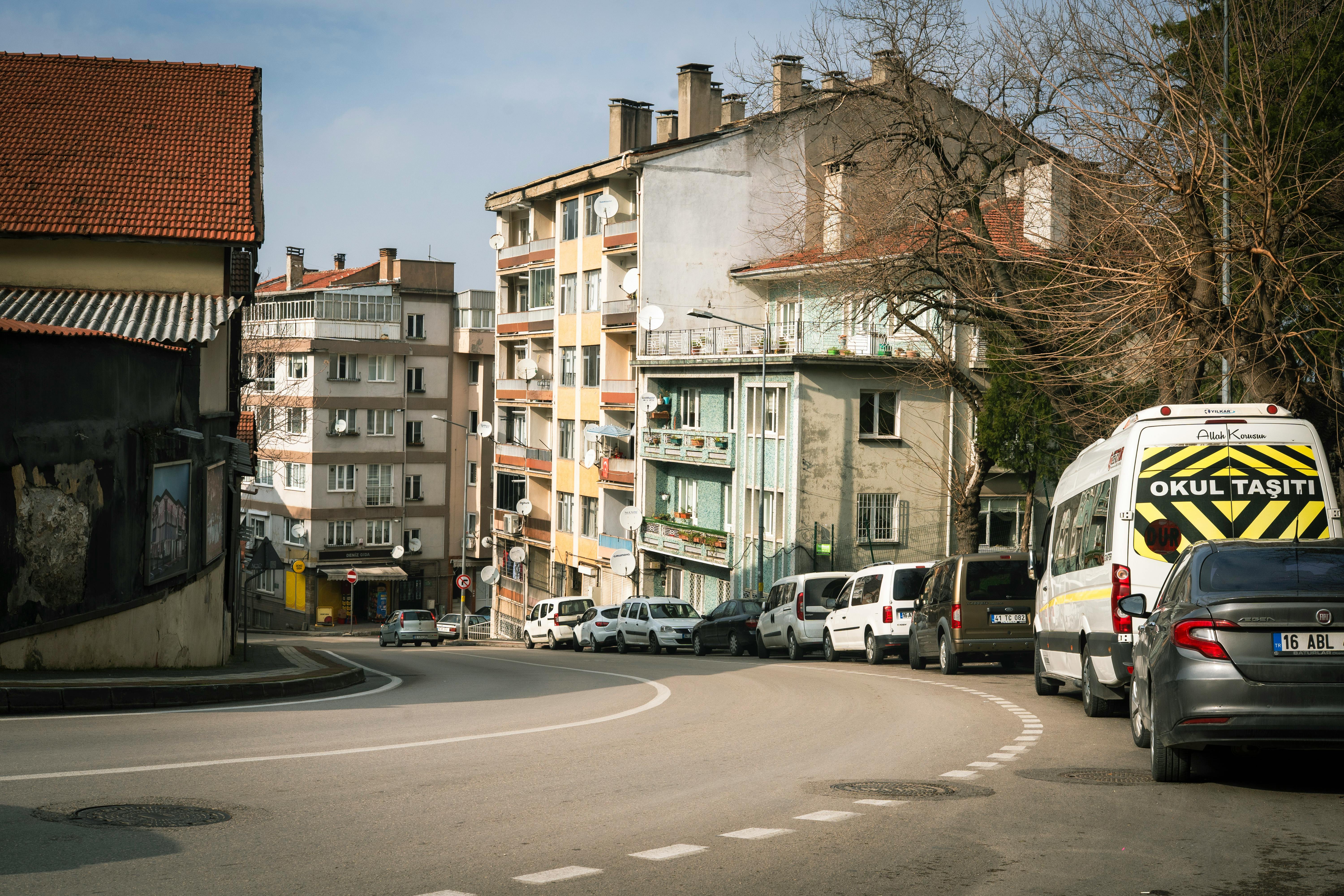 Neighborhood Scene With Houses, Schools, And Traffic Patterns