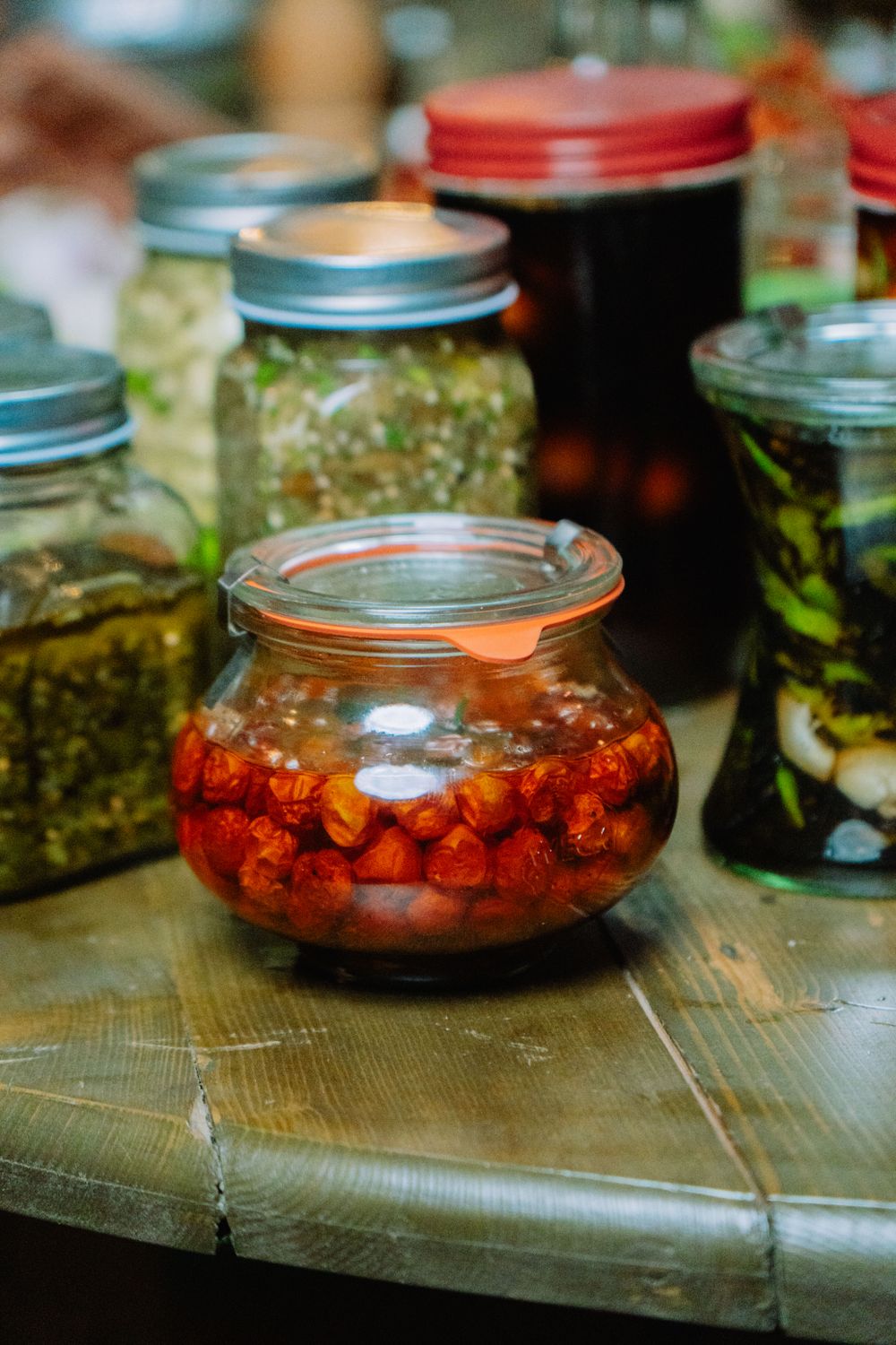 Jars of preserved vegetables on a table