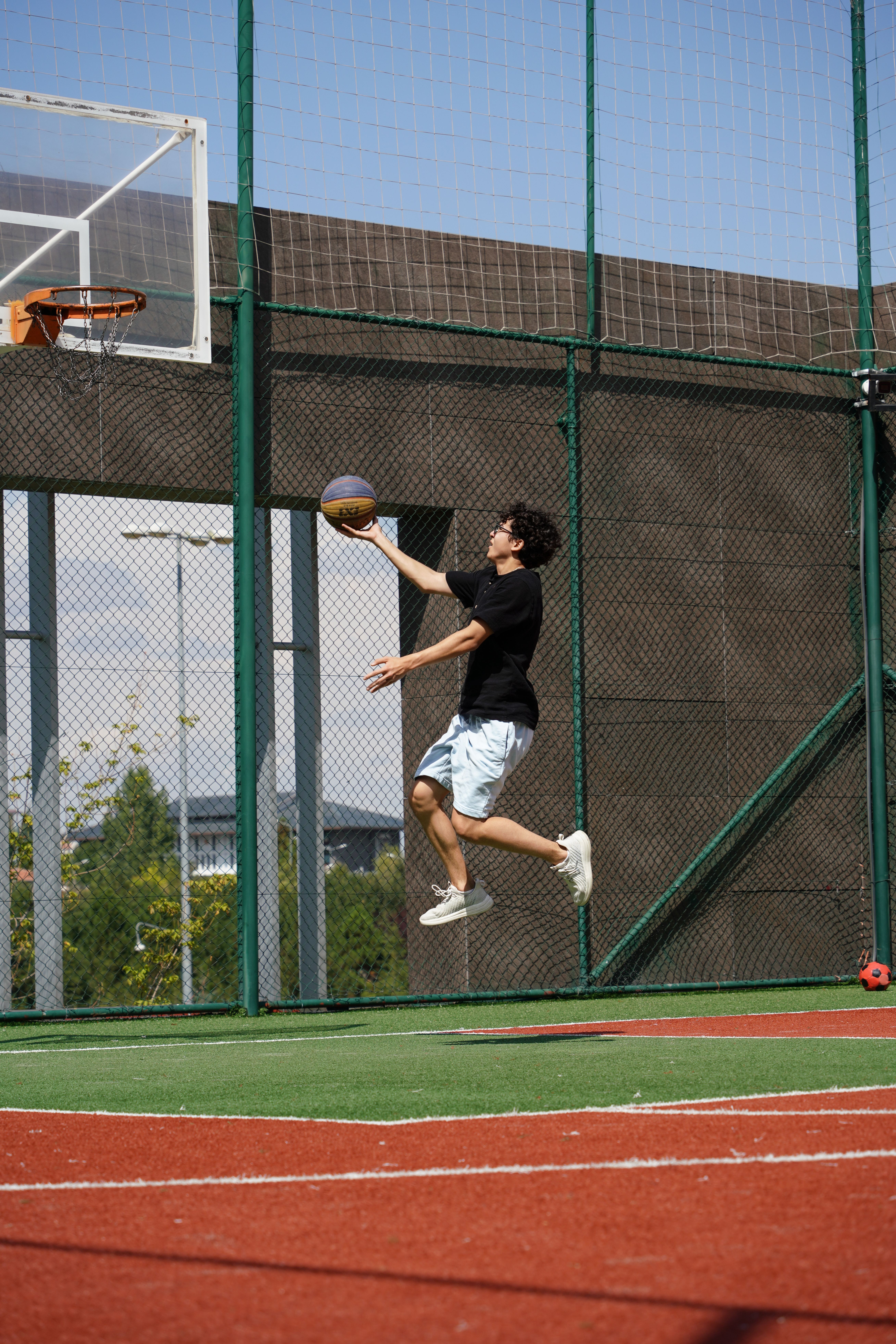 Dynamic Basketball Shot on Outdoor Court · Free Stock Photo
