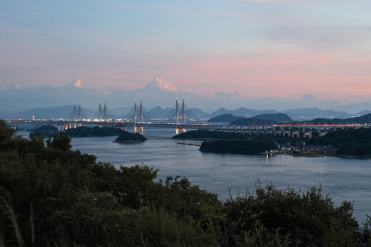 Serene evening view of Hitsuishijima Bridge spanning the Seto Inland Sea in Okayama, Japan.