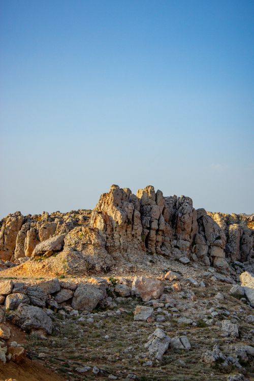 Free Dramatic rocky terrain under a clear blue sky in Mersin, Türkiye. Ideal for nature themes. Stock Photo
