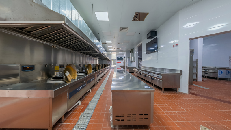 Modern industrial kitchen interior featuring stainless steel appliances