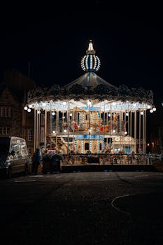 Stunning night shot of a lit carousel in Oxford, England, capturing vibrant lights and structure.