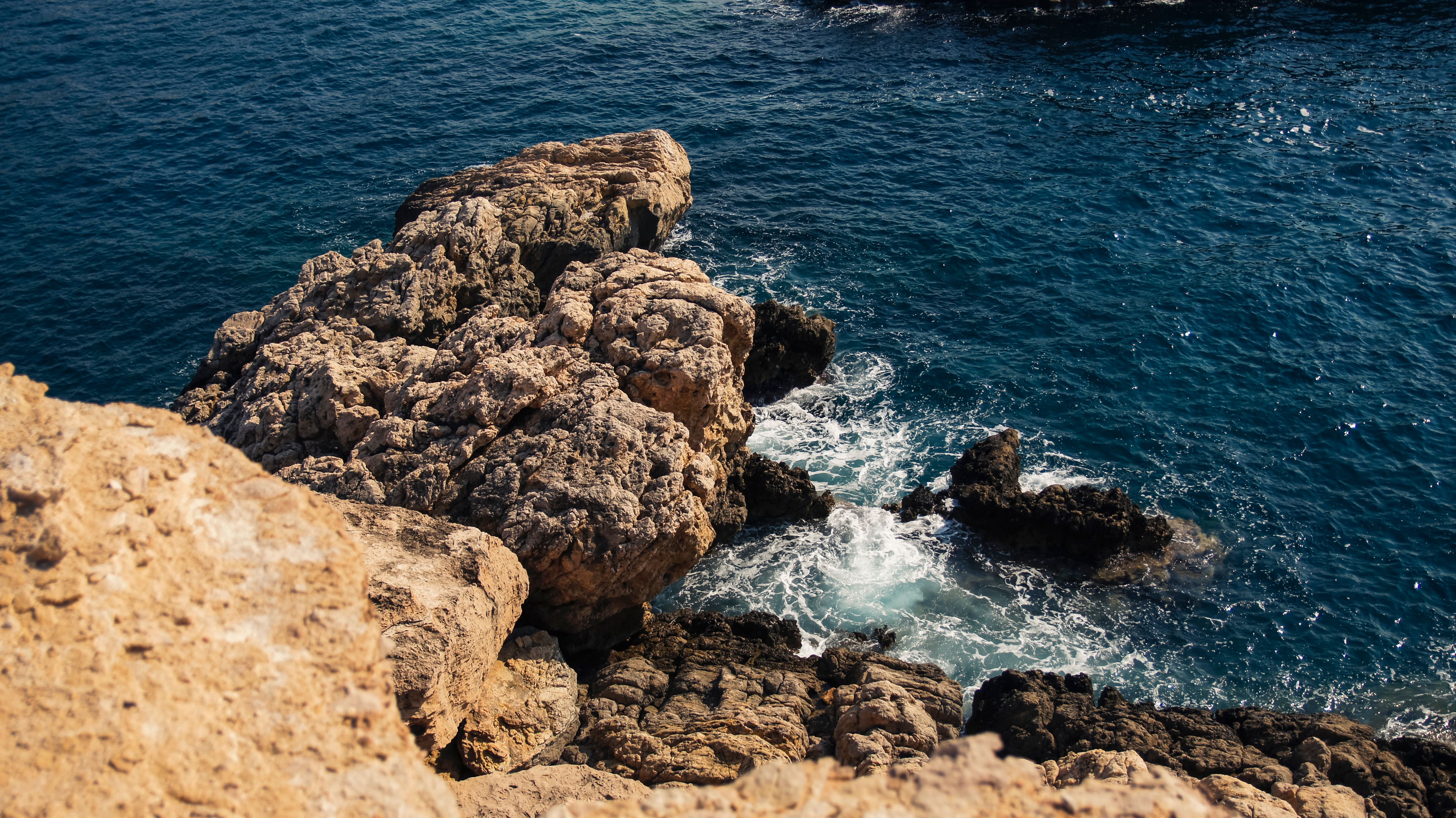 Dramatic Rocky Coastline with Waves · Free Stock Photo