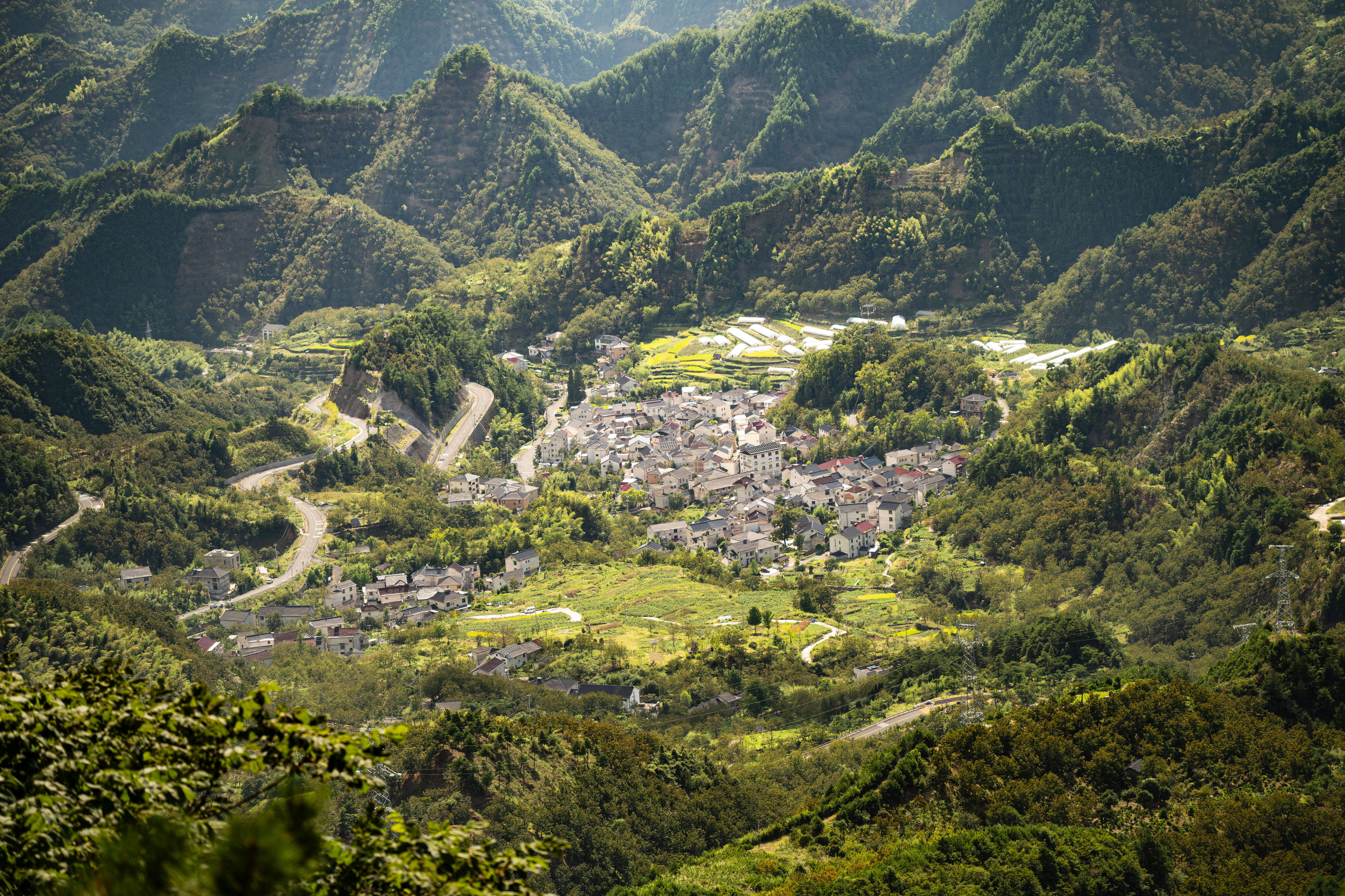 Aerial View of Mountain Village and Lush Green Landscape · Free Stock Photo