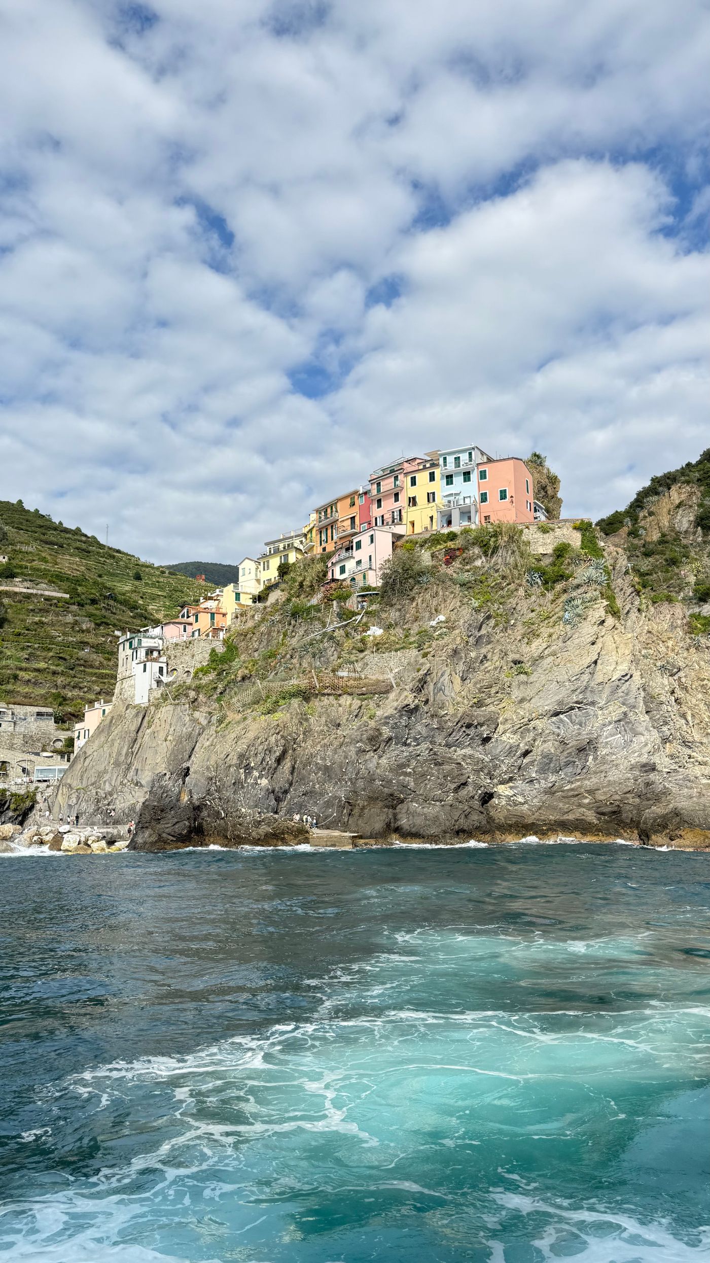 Riomaggiore, one of the five villages of the Cinque Terre, Italy, with houses stacked above the harbour