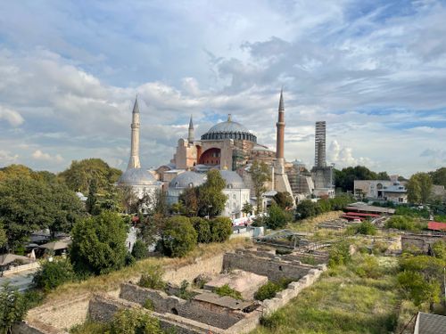 Free A stunning view of Hagia Sophia and surrounding Istanbul cityscape under a bright summer sky. Stock Photo