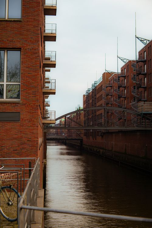 Free Charming canal view of Speicherstadt with iconic red brick warehouses in Hamburg. Stock Photo