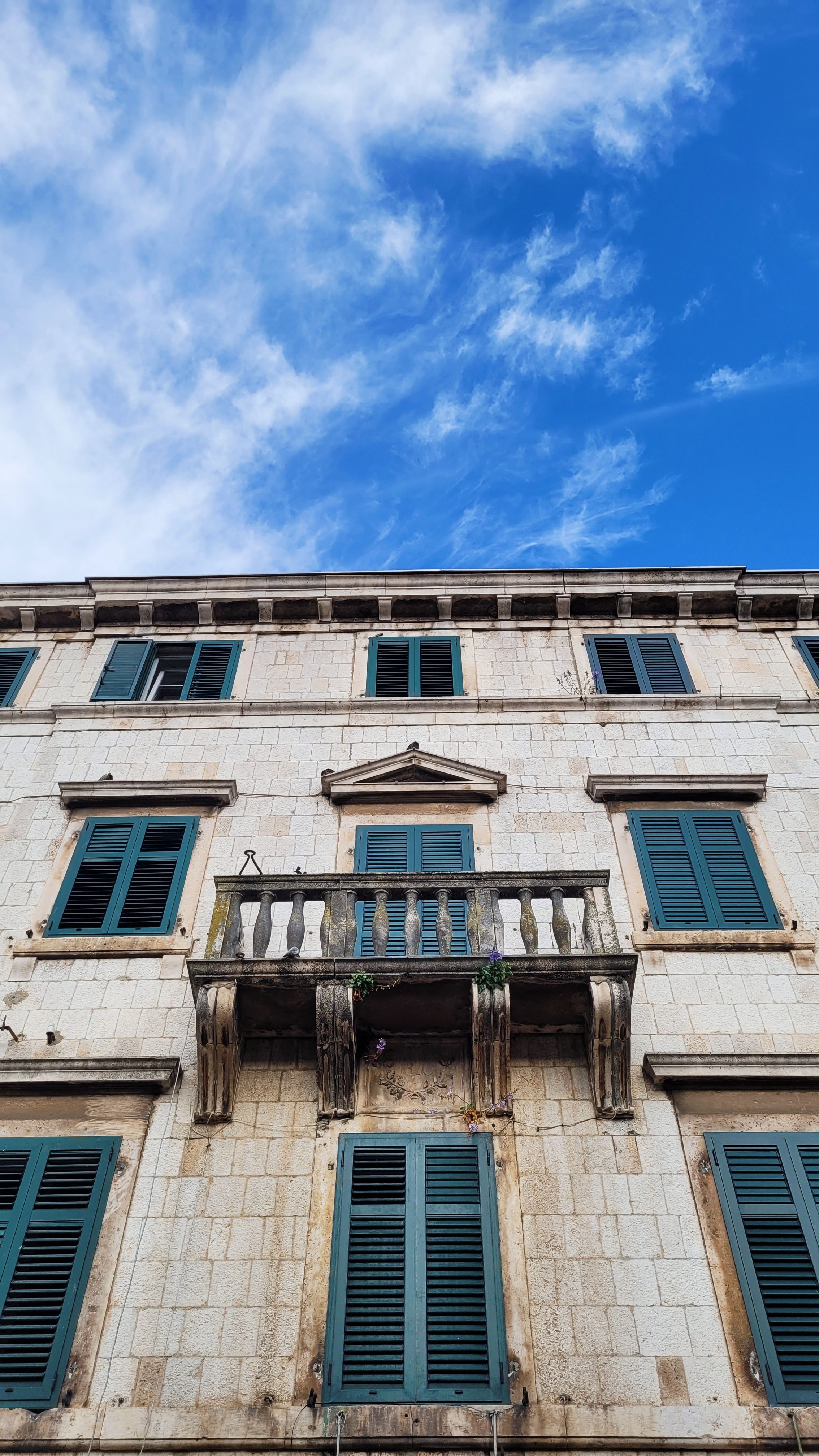 Historic European Building Facade with Blue Sky · Free Stock Photo