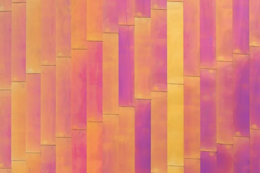 Close-up view of a vibrant multicolored metal facade with abstract geometric patterns.