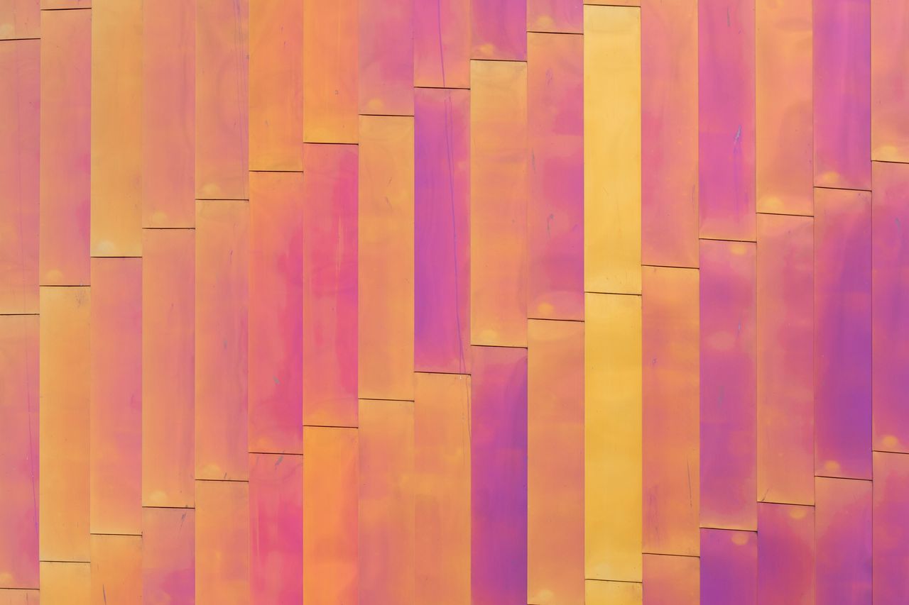 close up view of a vibrant multicolored metal facade with abstract geo
