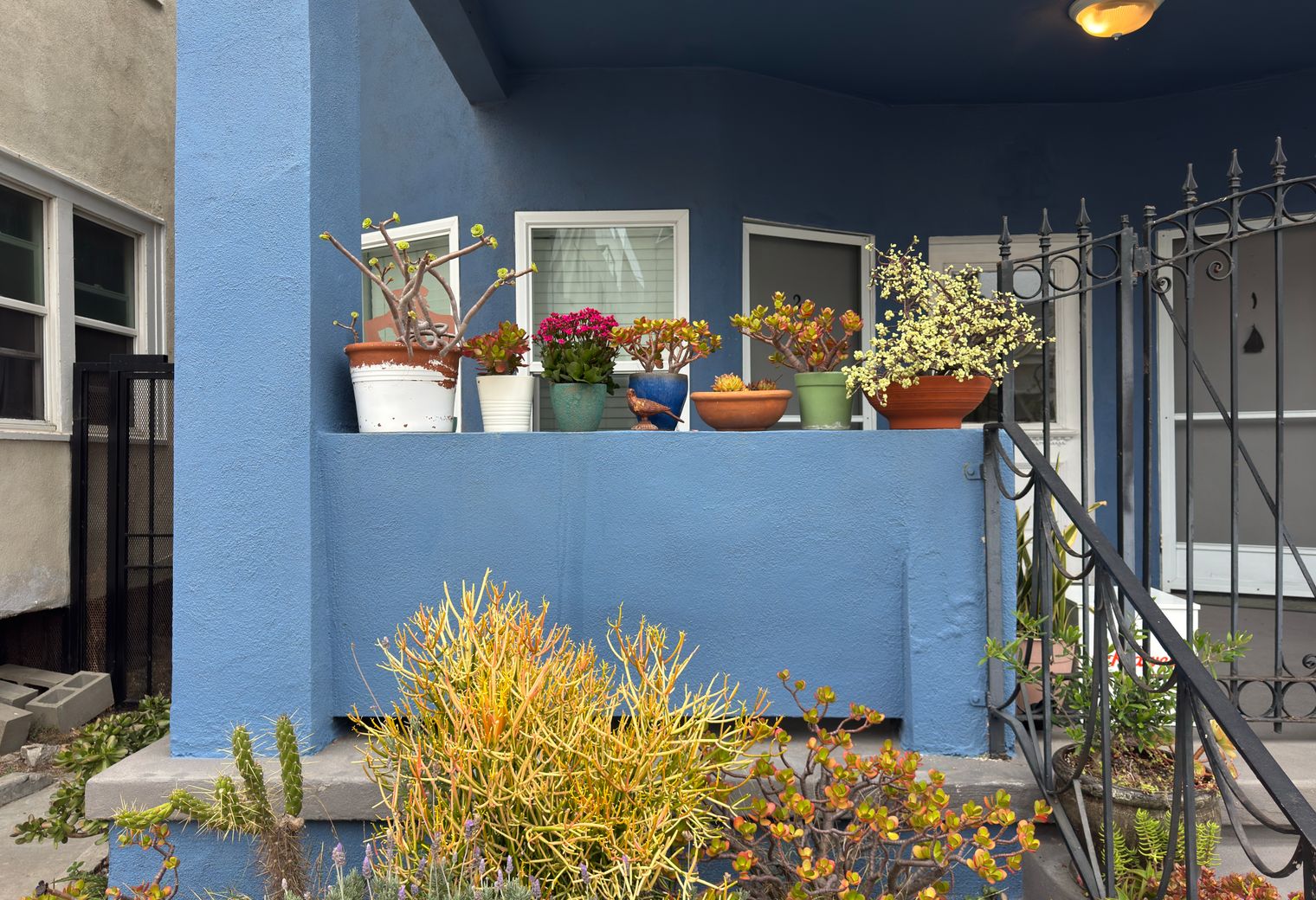 Masonry and Render Painting in Thames View — careful masking before painting begins