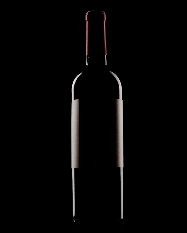 Champagne bottle silhouette glowing against a black background