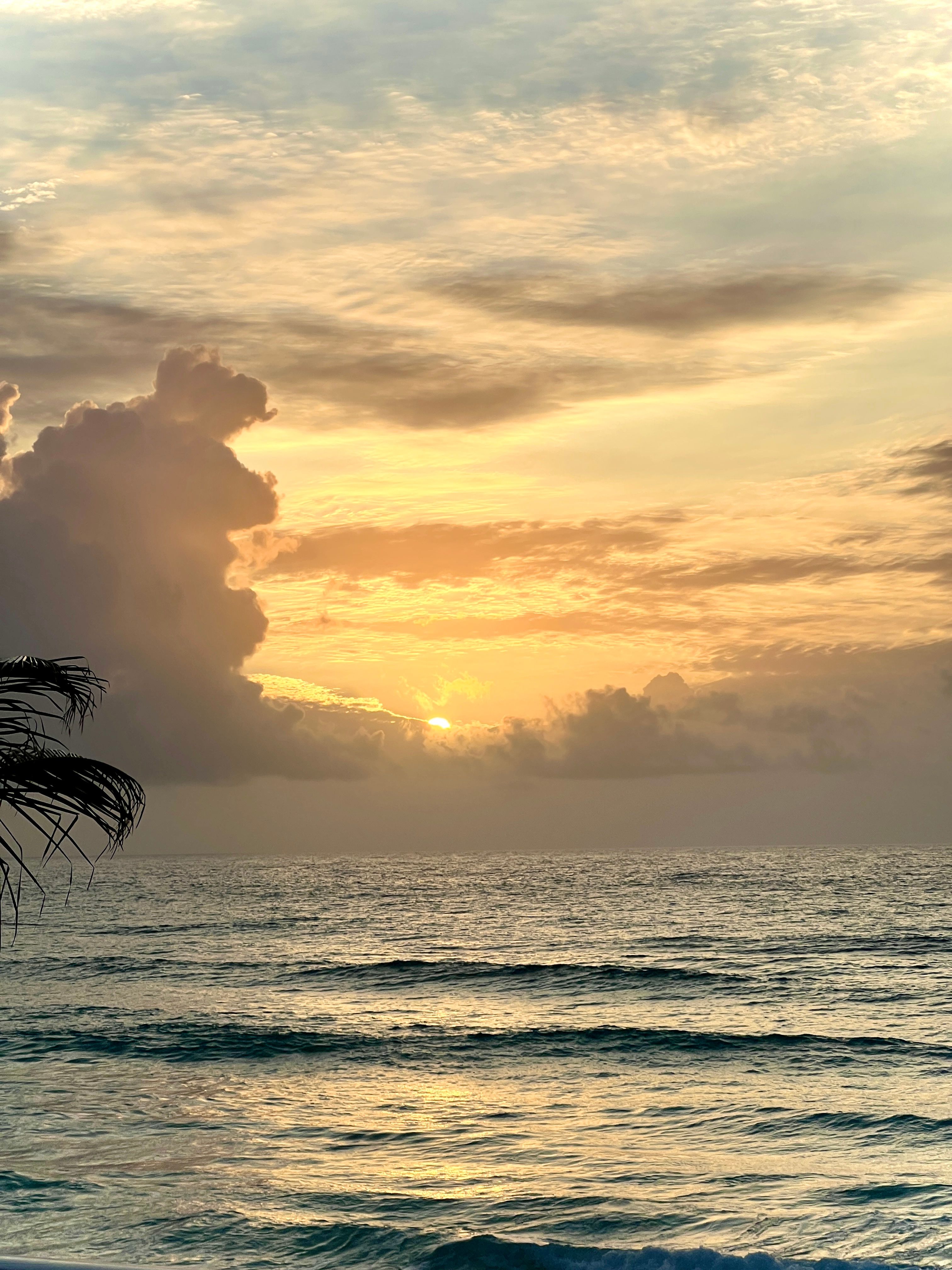 Sunrise Over Tranquil Ocean with Dramatic Clouds · Free Stock Photo
