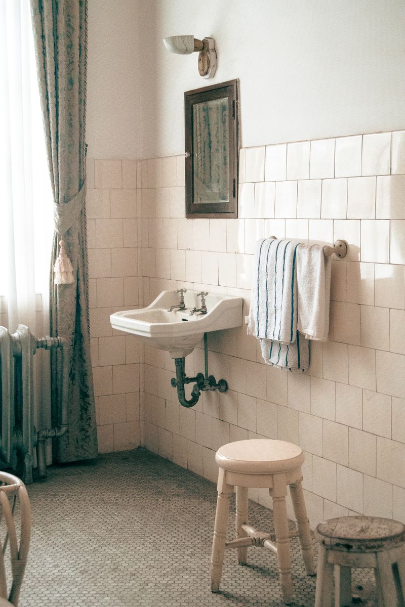 Bathroom with tiled walls and vintage fittings
