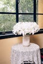 Elegant White Lilies in Vase by Window