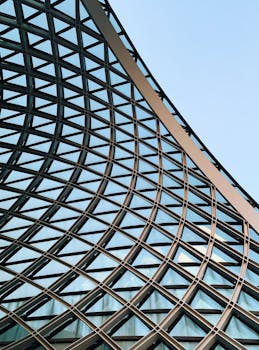 Close-up of a futuristic geometric steel and glass architecture with a modern design.