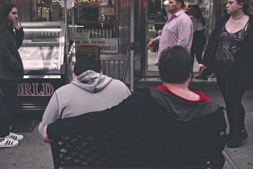 Group of People Standing Near Stall