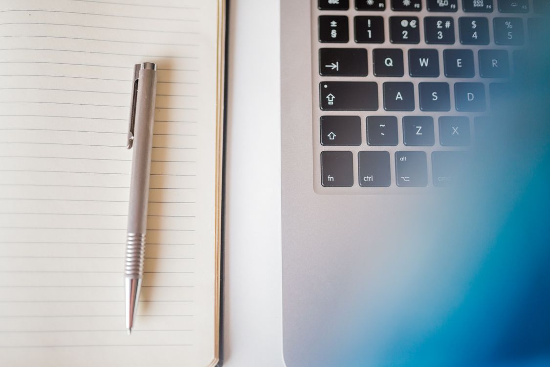 Pen Paper And Computer Grey Pen in White Lined Paper Beside Grey Laptop Computer · Free Stock ...