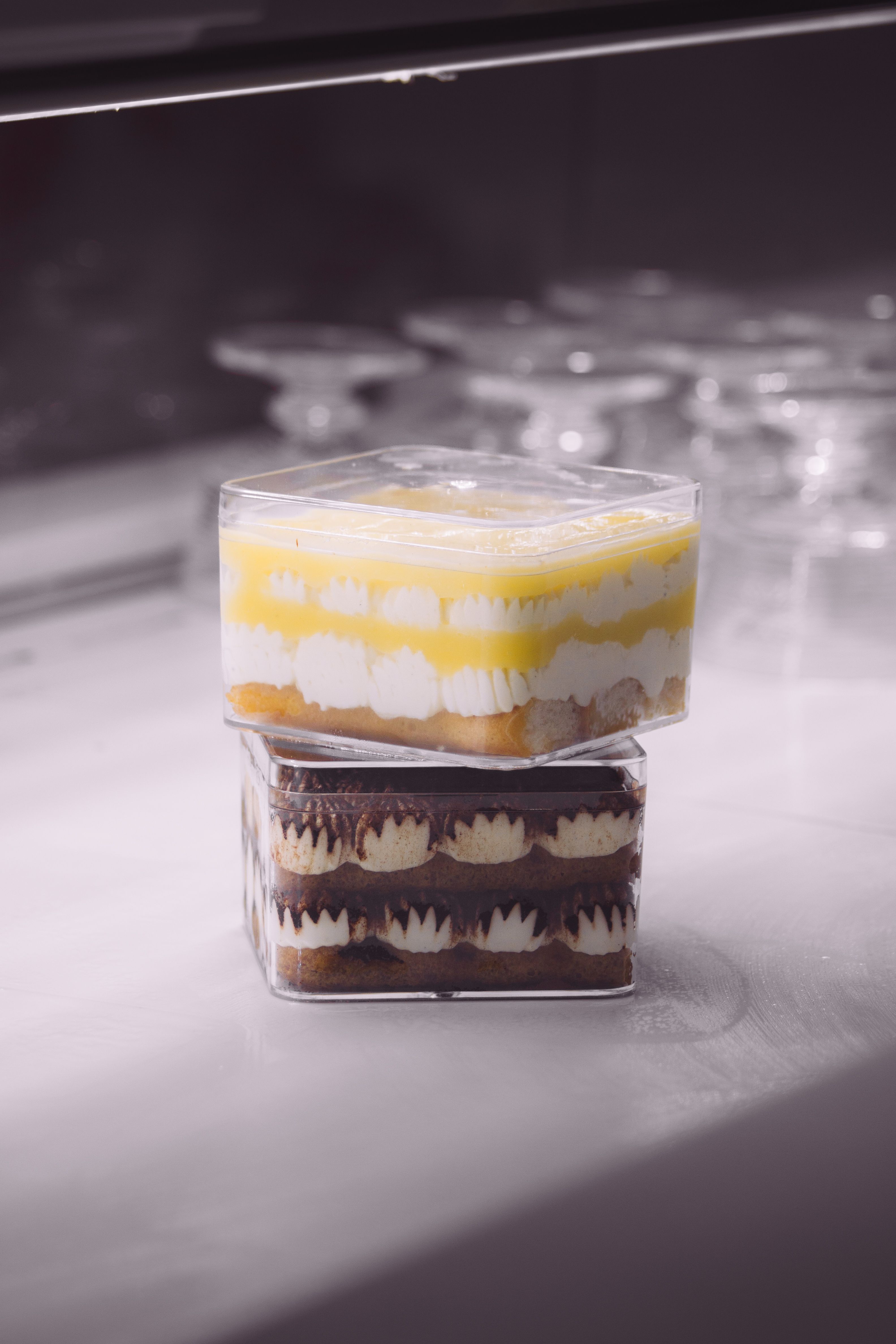 Stacked Gourmet Desserts in Plastic Containers · Free Stock Photo