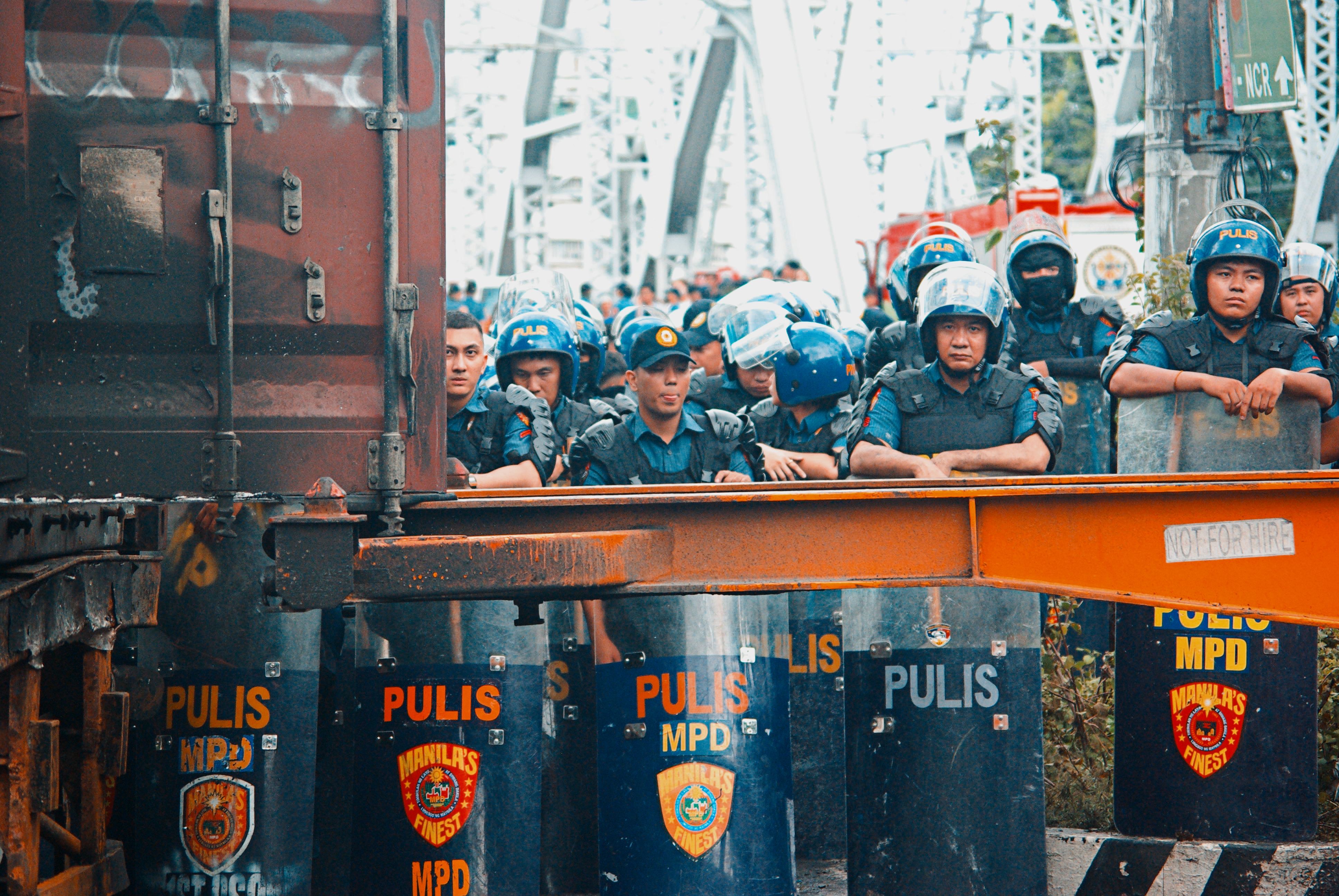 Police Stand Guard During Protest in Manila · Free Stock Photo