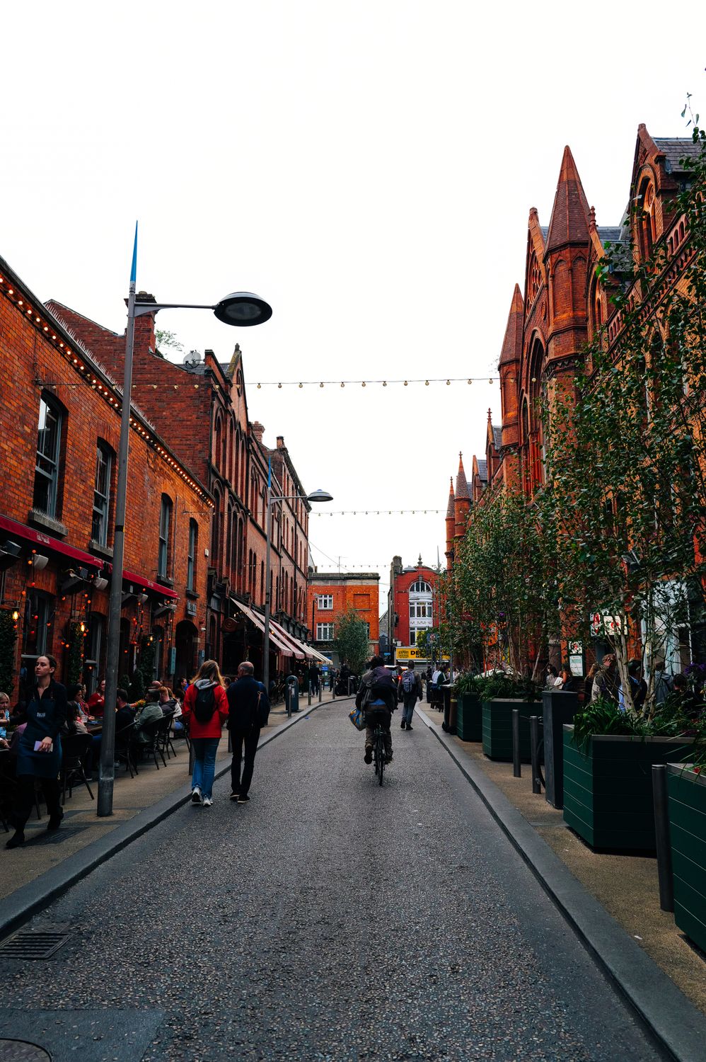Vibrant European Street Scene with Red Brick Architecture · Free Stock ...