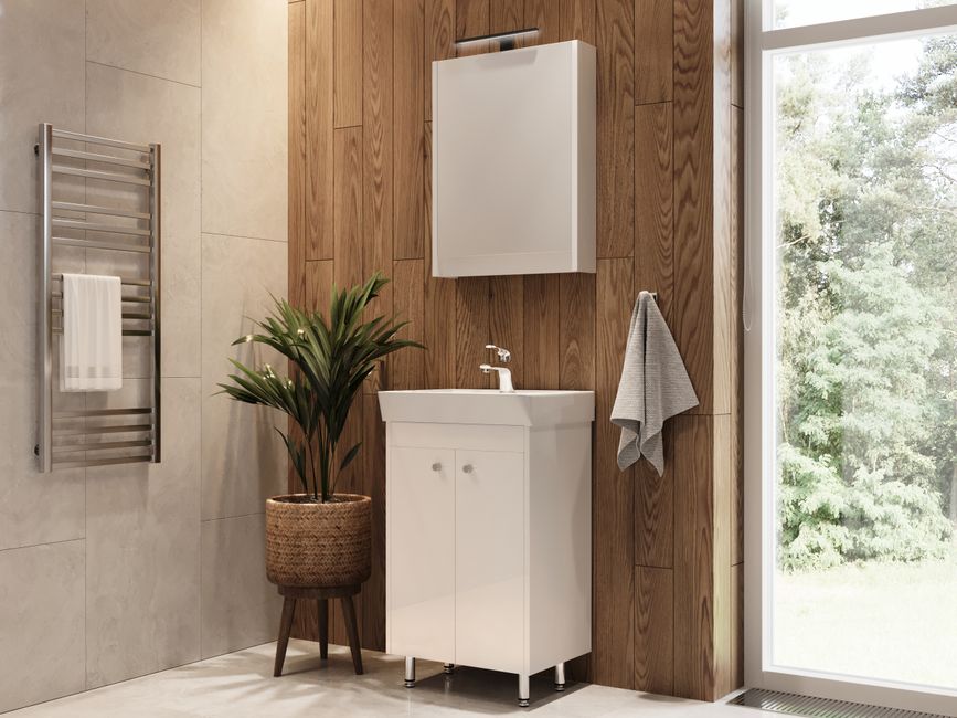 Bright bathroom featuring a wooden accent wall, plant, and large window.