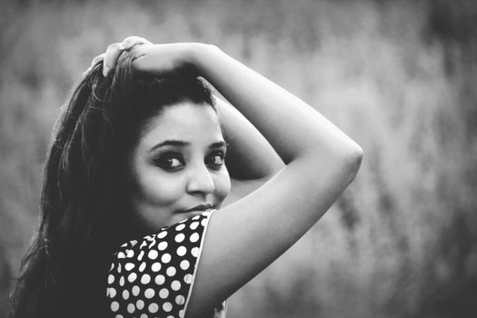 Expressive black and white portrait capturing the soulful eyes of a woman in Rangamati, Bangladesh.