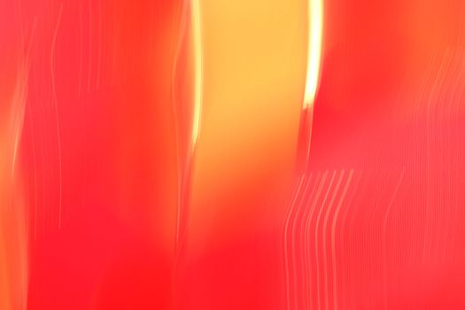 Dynamic abstract image featuring vibrant red and orange light streaks creating an artistic and modern aesthetic.