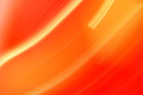 Free Dynamic abstract image of orange and red light trails conveying motion and energy. Stock Photo
