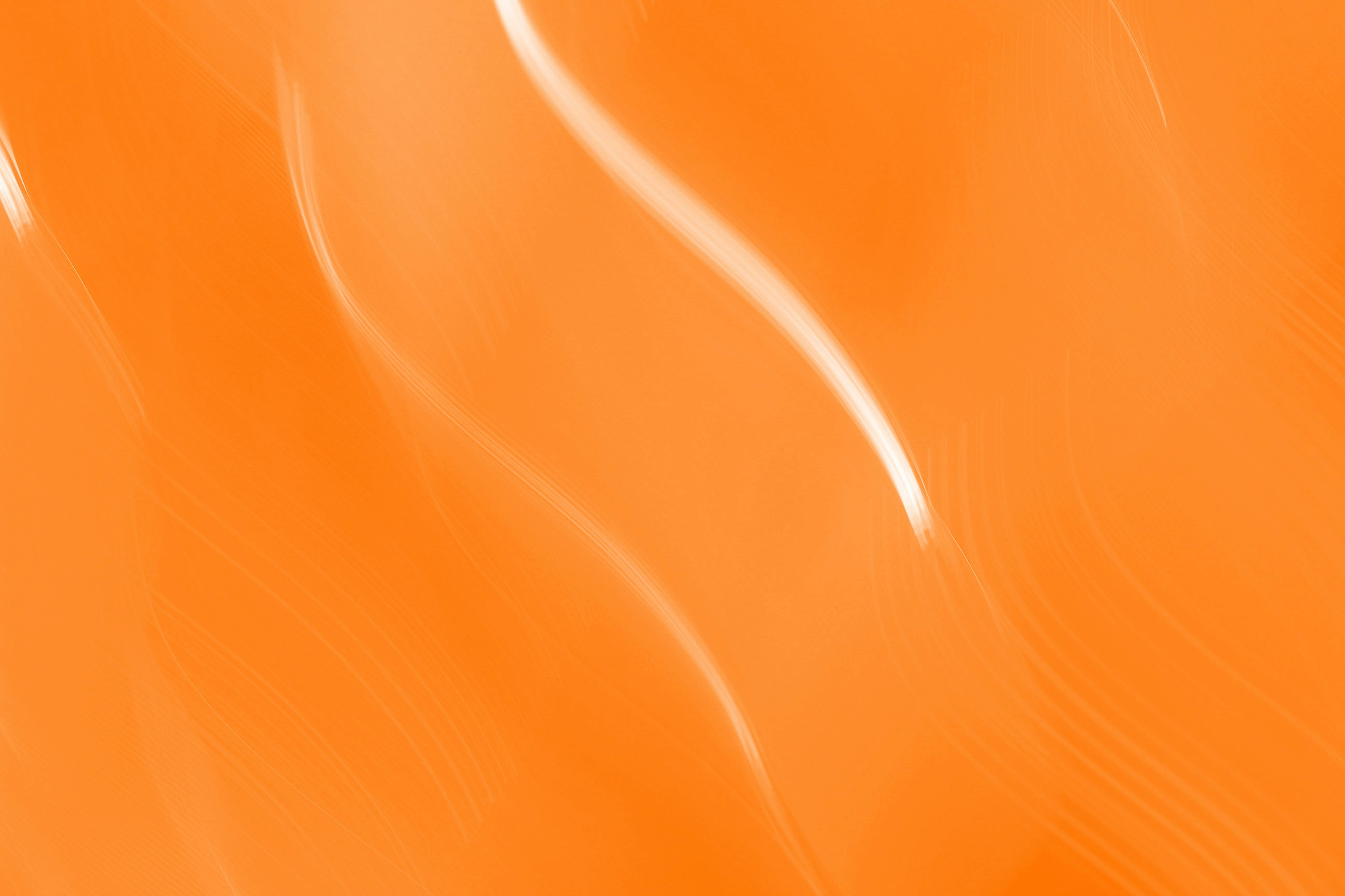 Gratis Et levende abstrakt billede med dynamiske orange bølger, perfekt til dristige designs. Lagerfoto