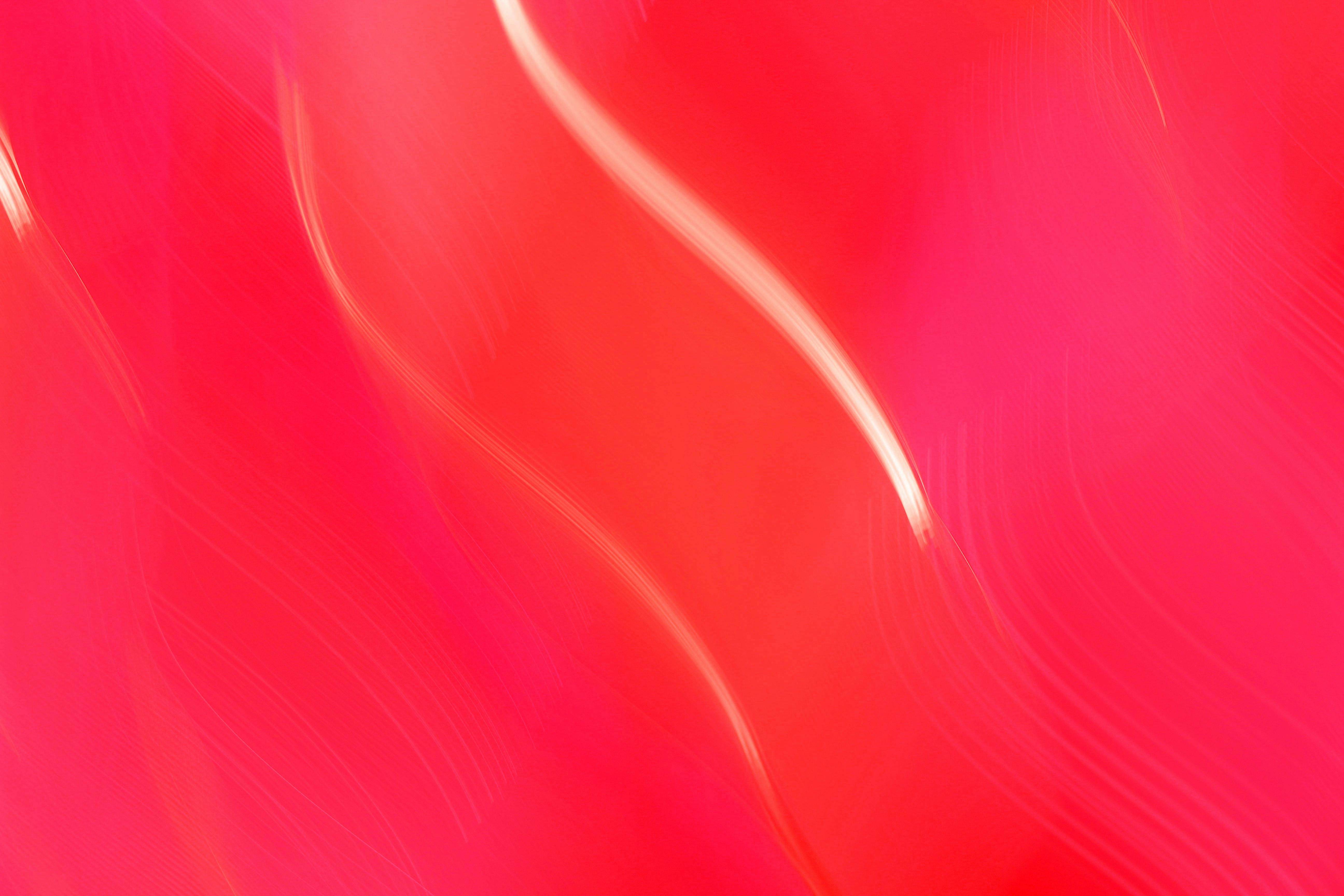Free Vibrant abstract image of wavy red and pink lines creating a dynamic and fluid motion effect. Stock Photo