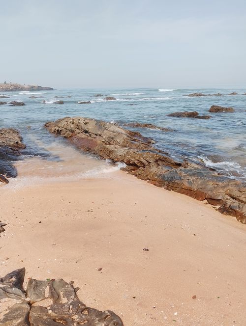 Free Pristine beach with rocky shorelines and calm sea in Casablanca, Morocco. Stock Photo