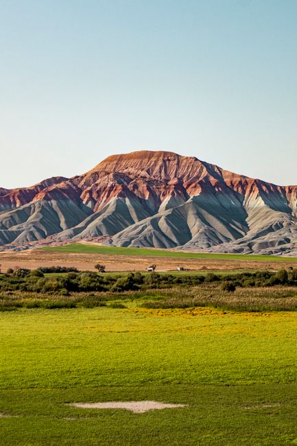 Vivid landscape capturing the colorful hills of Nallıhan, Ankara, with vibrant greenery in the foreground.