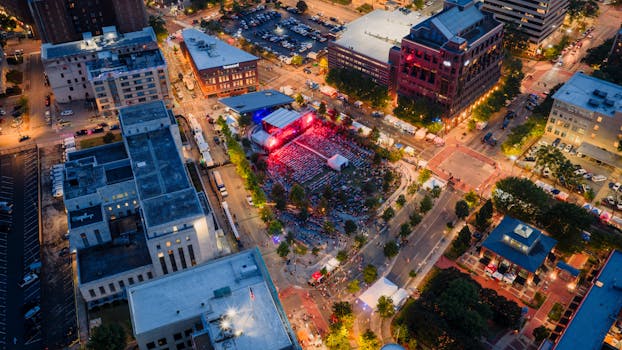 Aerial evening view of a vibrant outdoor concert in downtown Chattanooga, Tennessee.