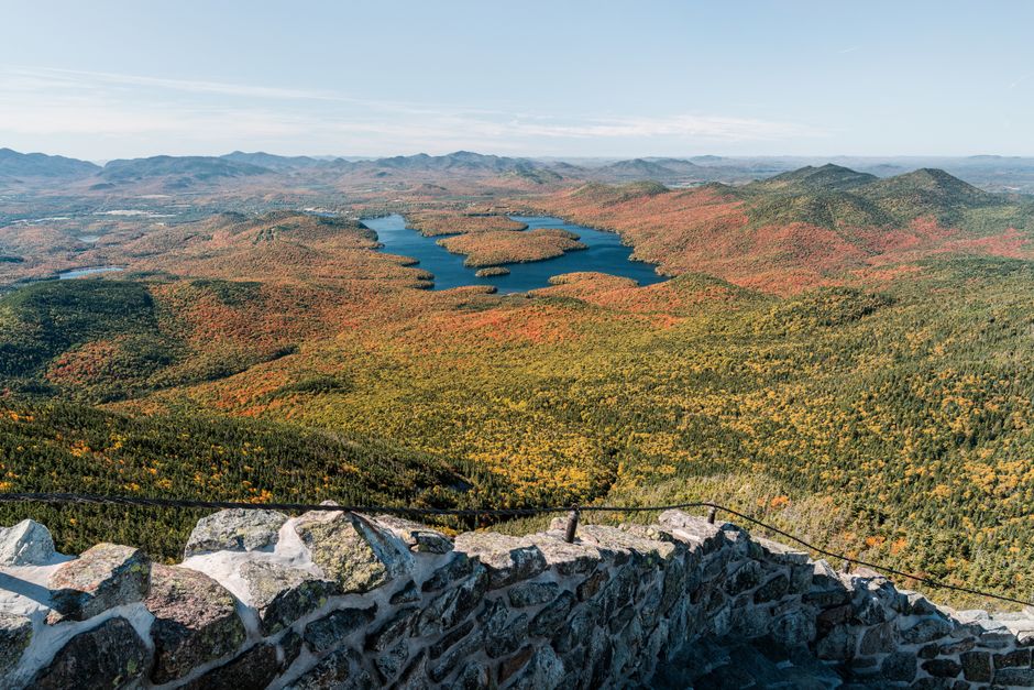 Private Lake Placid Olympic Experience via Private Helicopter from NYC - Scenic autumn landscape from Whiteface Mountain in Wilmington, New York, showcasing vibrant foliage and distant lakes.
