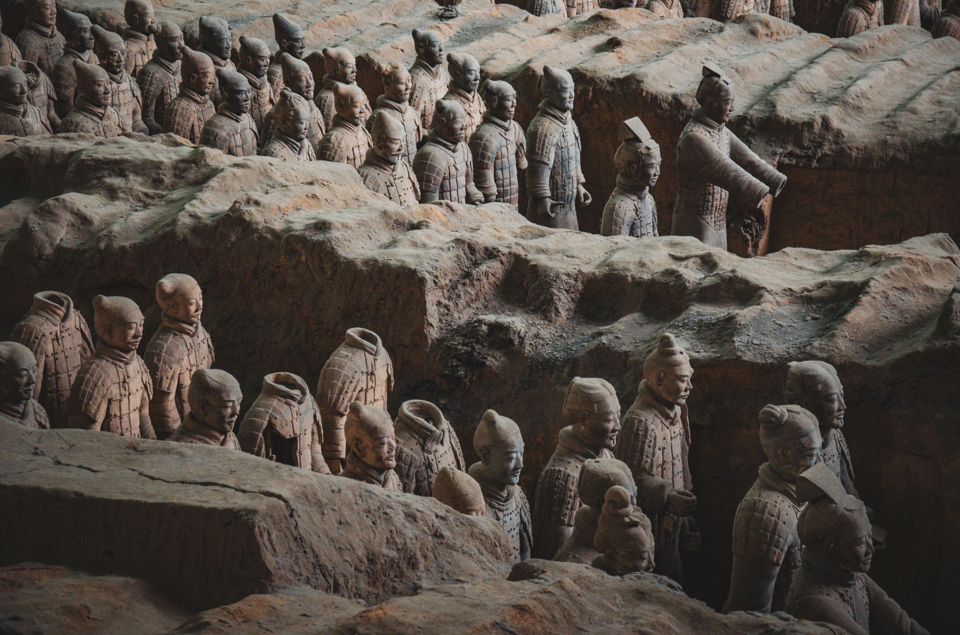 Explore the iconic Terracotta Army in Xi'an, showcasing ancient Chinese sculptures of warriors and horses. Captured in detail.