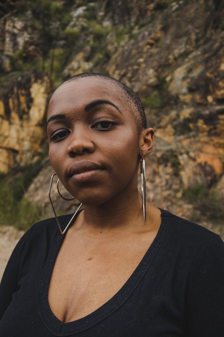 Stylish Black Woman In Big Earrings Near Mount