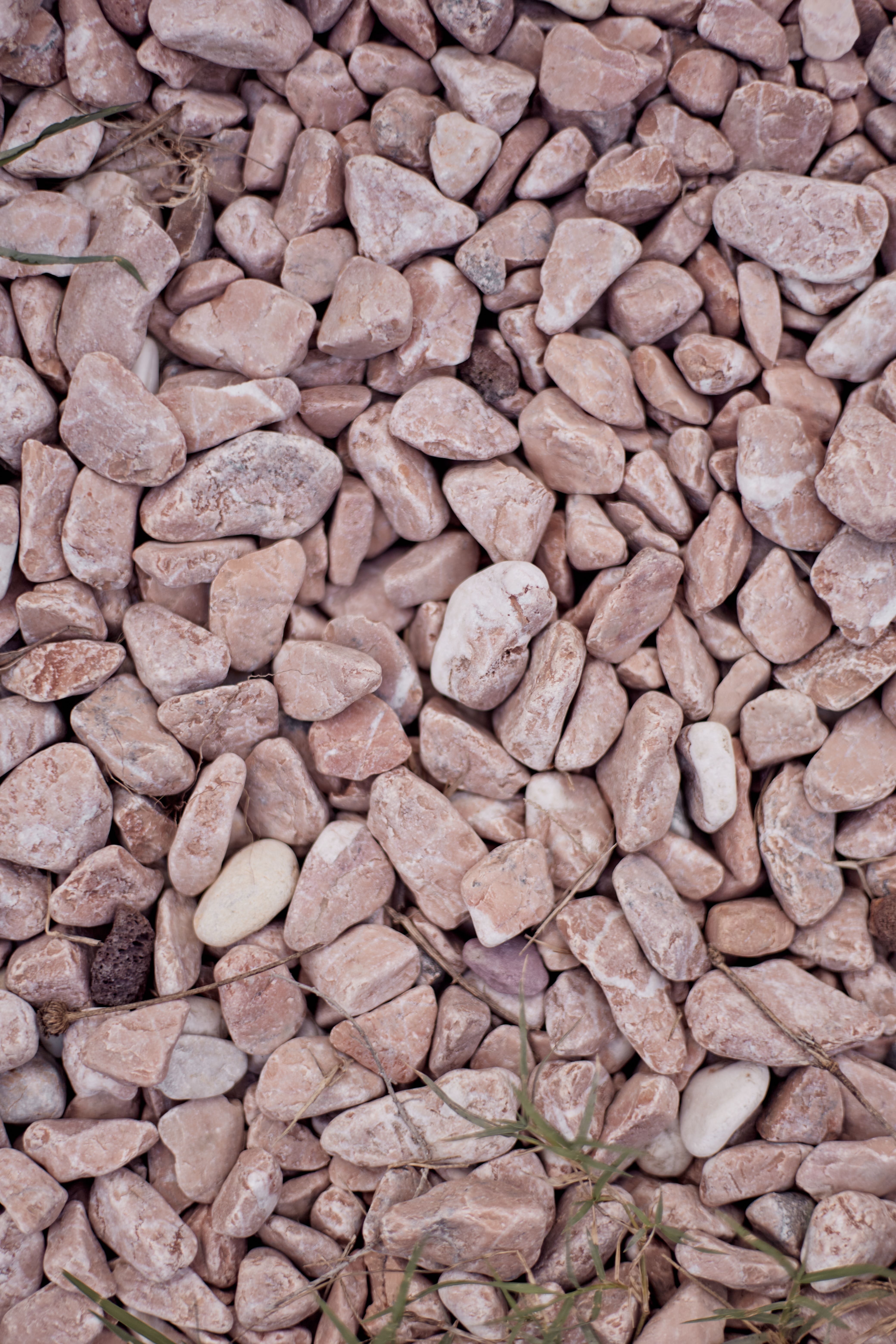 Detailed view of natural river pebbles with mixed colors and textures in Istanbul, Türkiye.