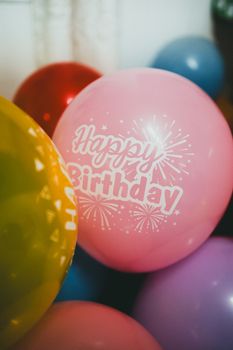 Vibrant 'Happy Birthday' balloons creating a festive party atmosphere.
