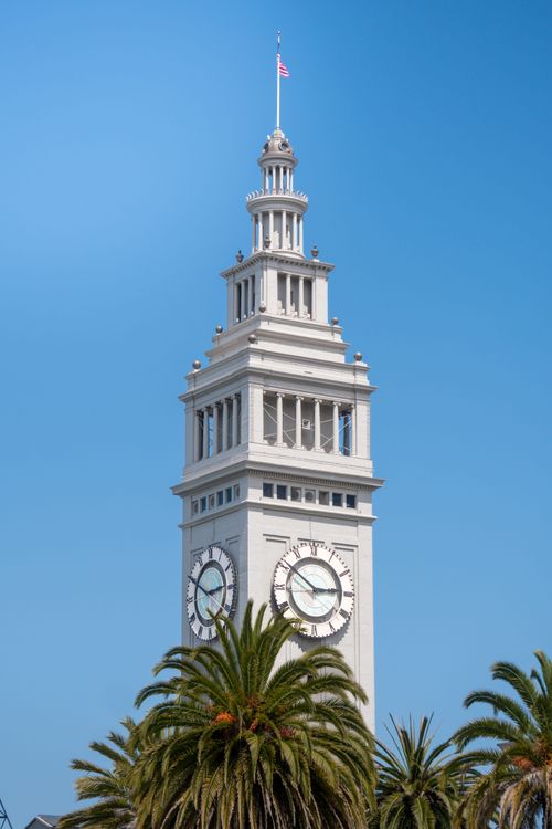 Free A striking view of the Ferry Building Clock Tower against a clear blue sky in San Francisco. Stock Photo