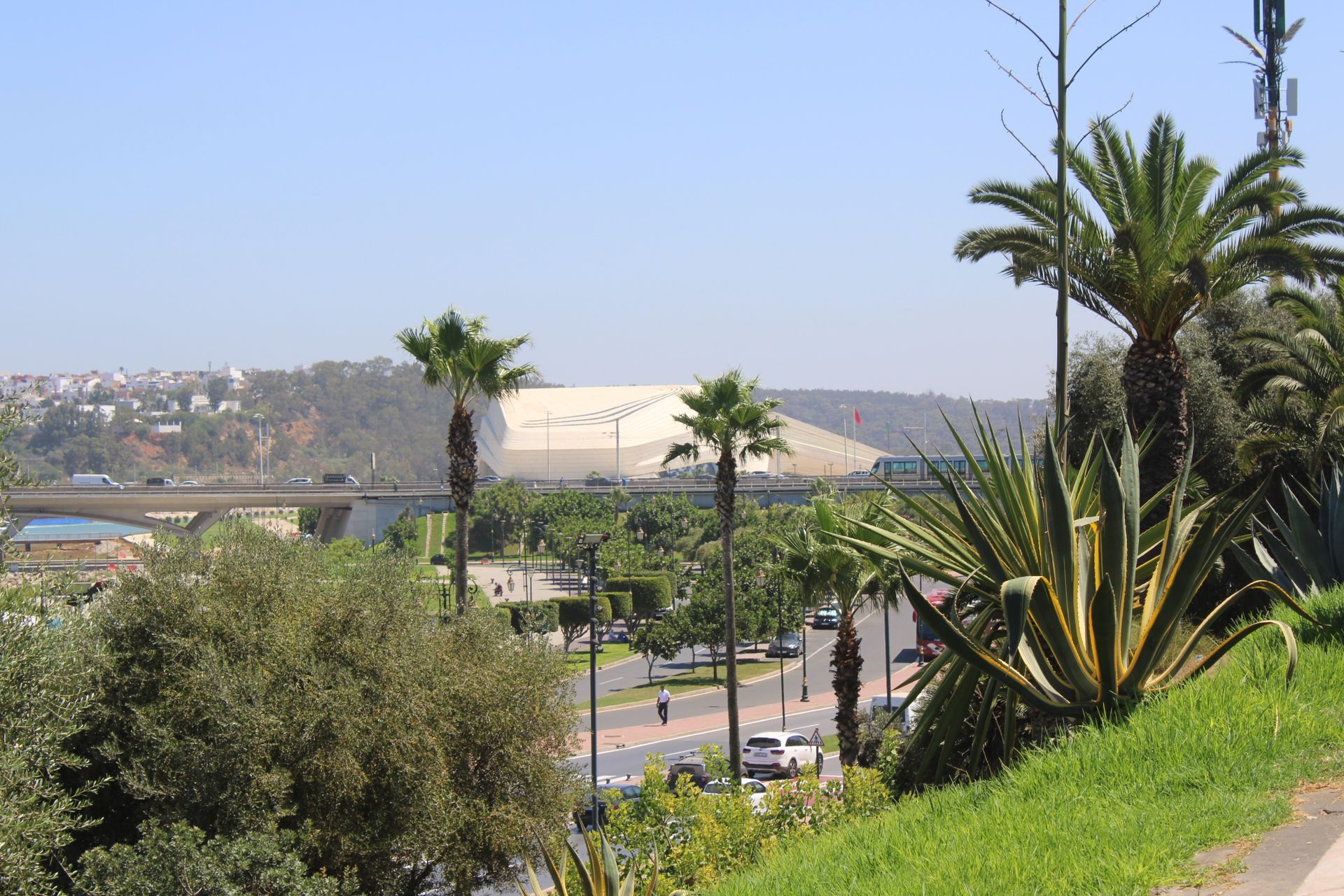 Bright cityscape of Rabat featuring palm trees and modern infrastructure under clear skies.