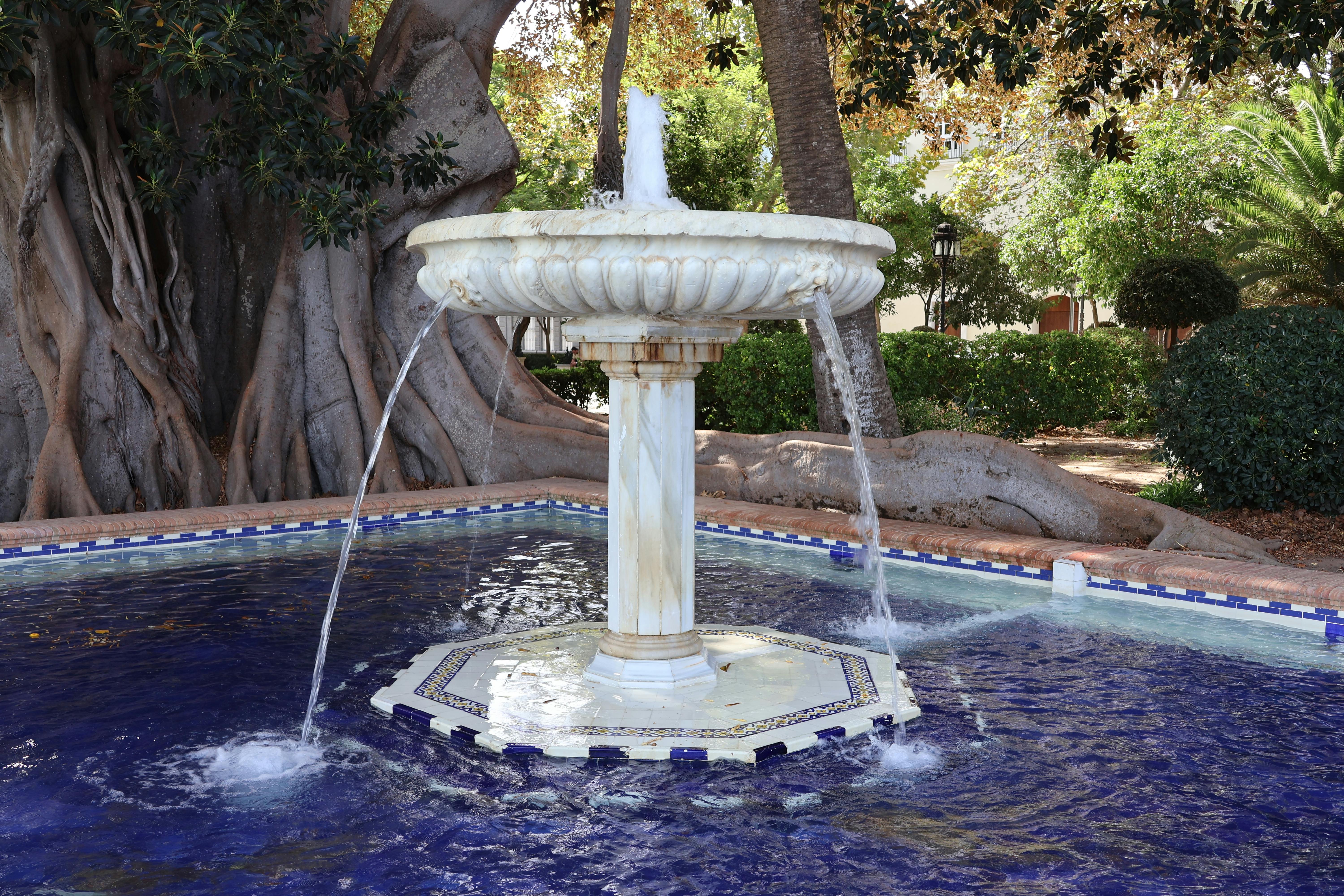 A beautifully crafted fountain in an urban park setting in Cádiz, Spain.