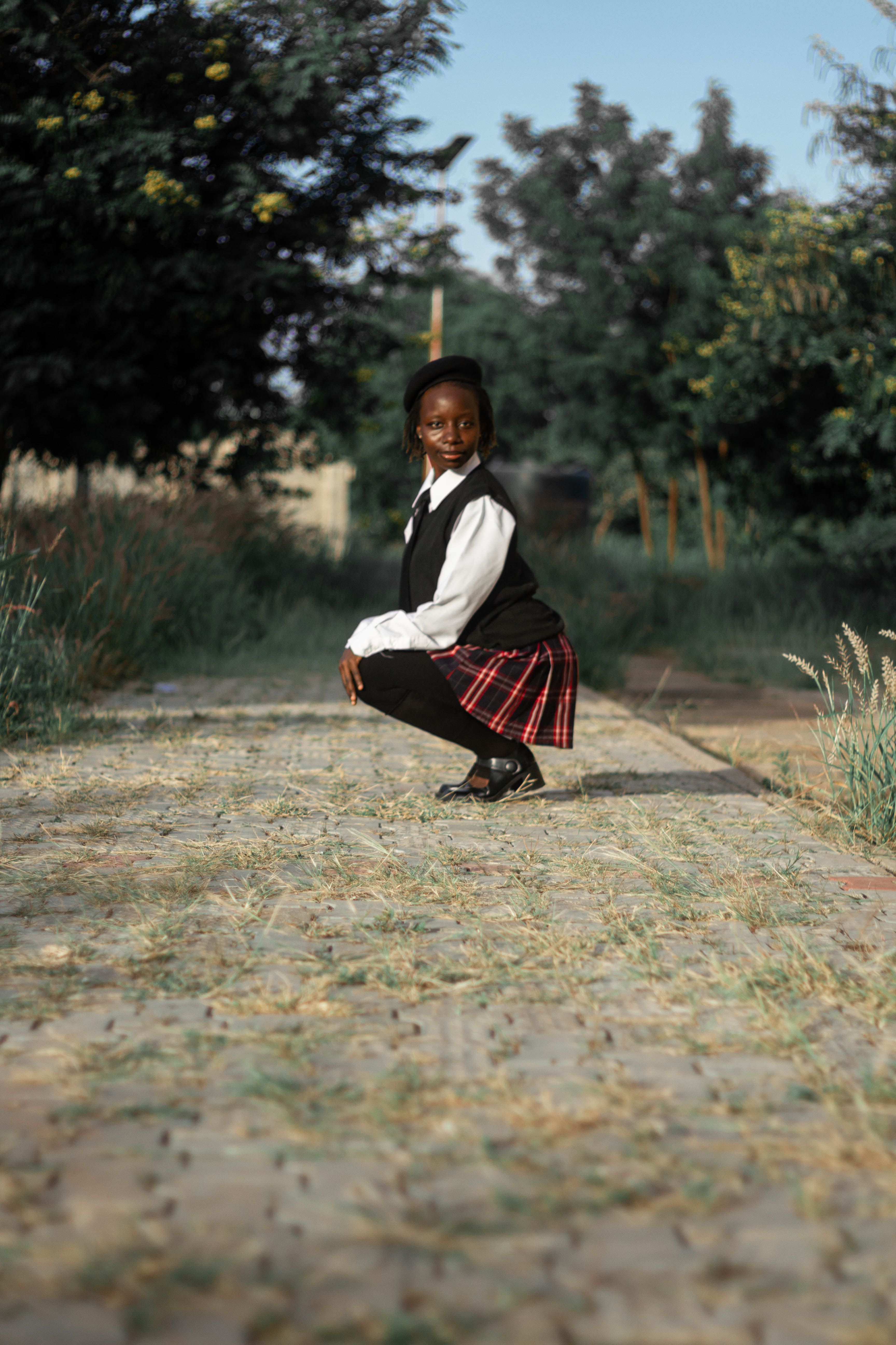 Young Girl in School Uniform Outdoors · Free Stock Photo