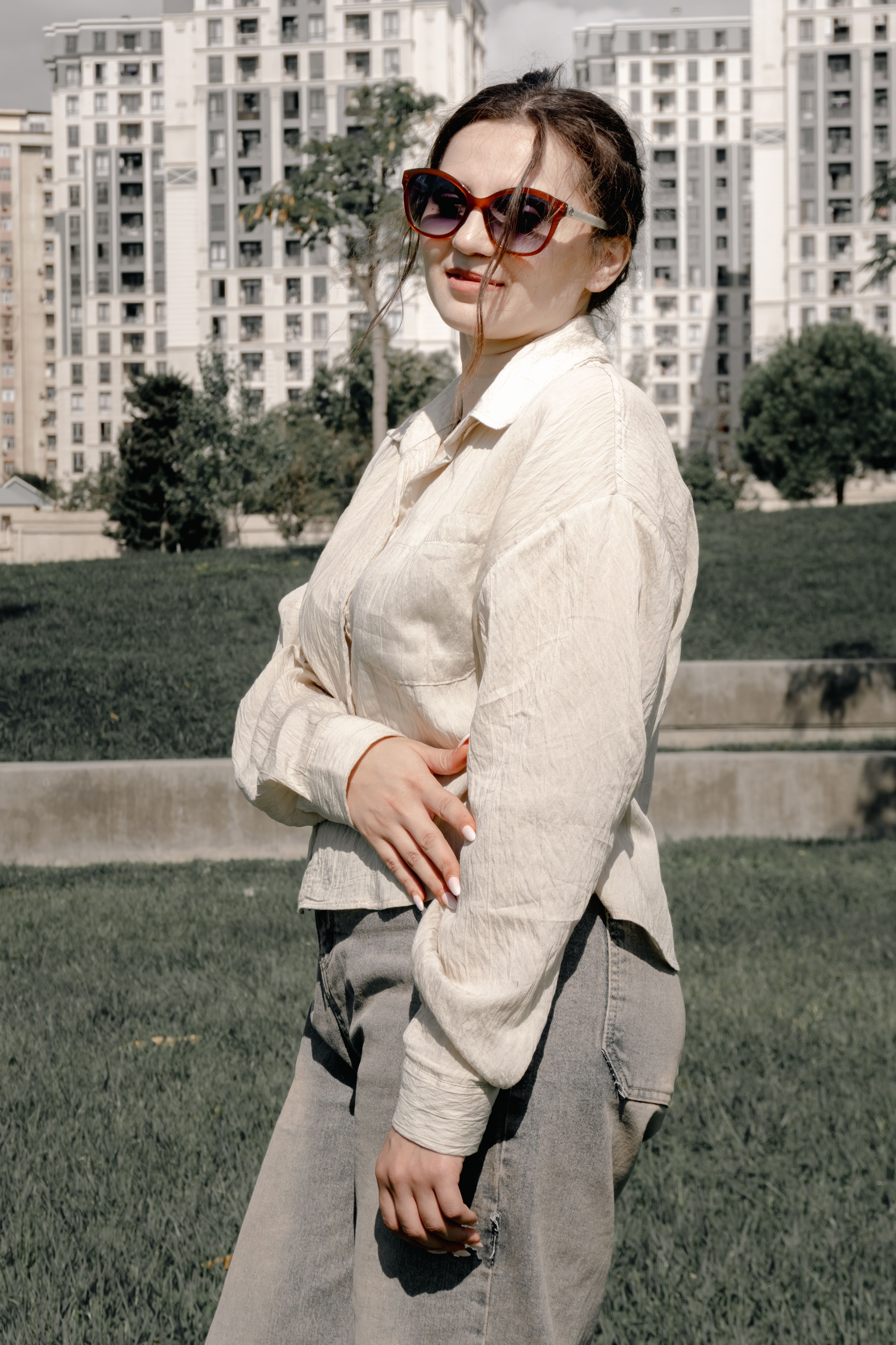 Stylish Woman Posing Outdoors in Urban Setting · Free Stock Photo
