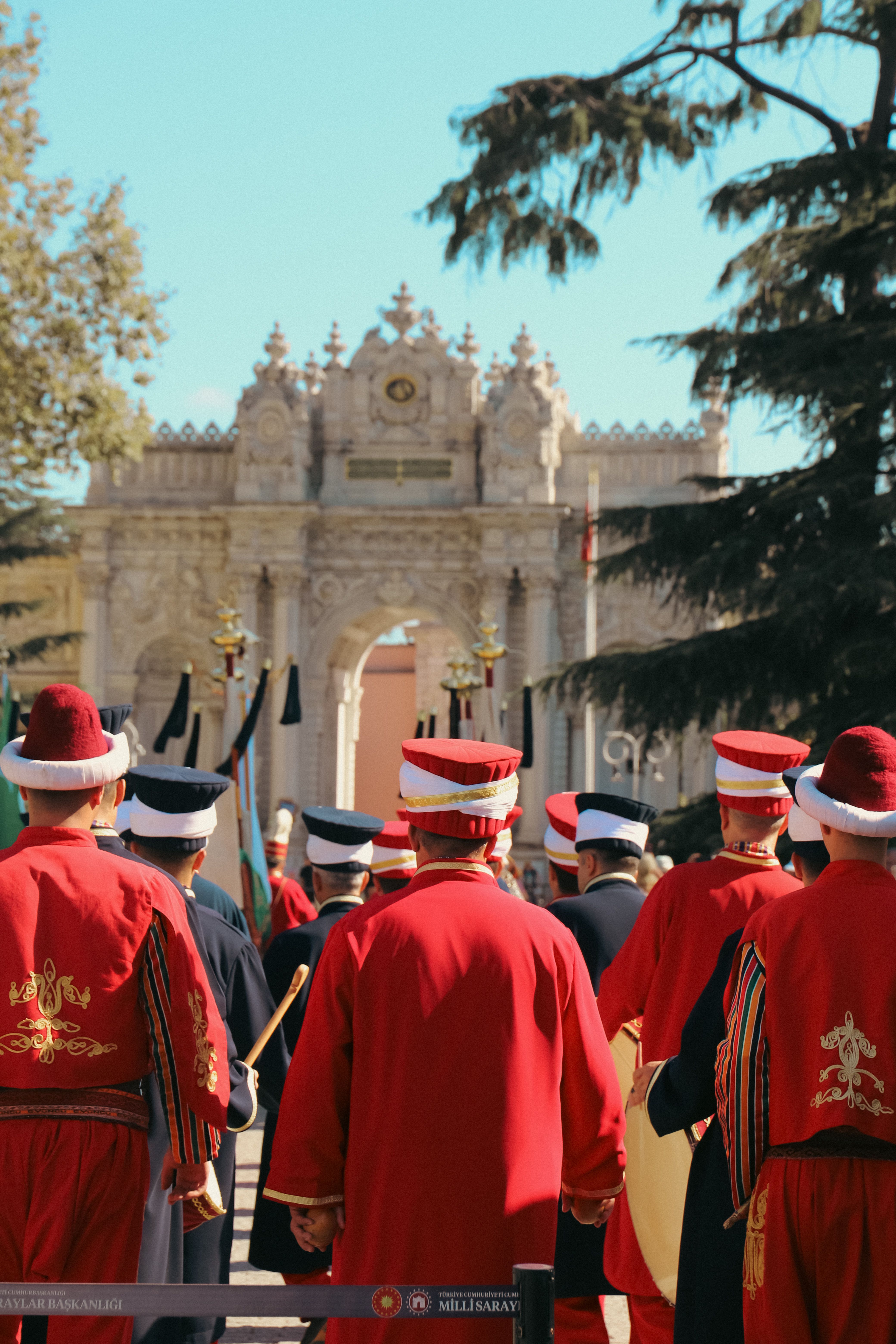Colorful traditional Turkish guards in a ceremonial march at Dolmabahçe Palace, Istanbul.