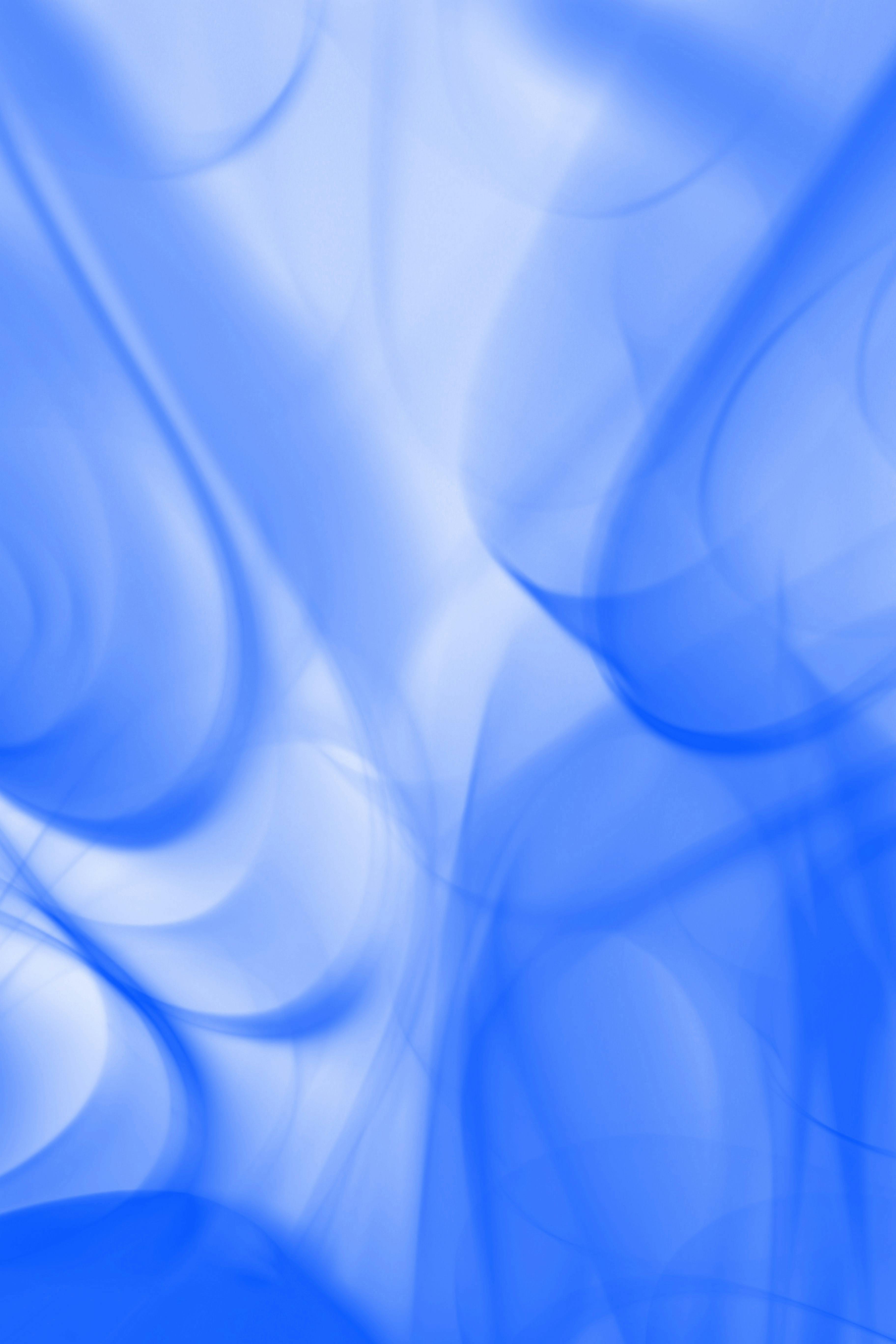 Free Dynamic abstract art featuring fluid blue wave patterns creating a calming visual effect. Stock Photo
