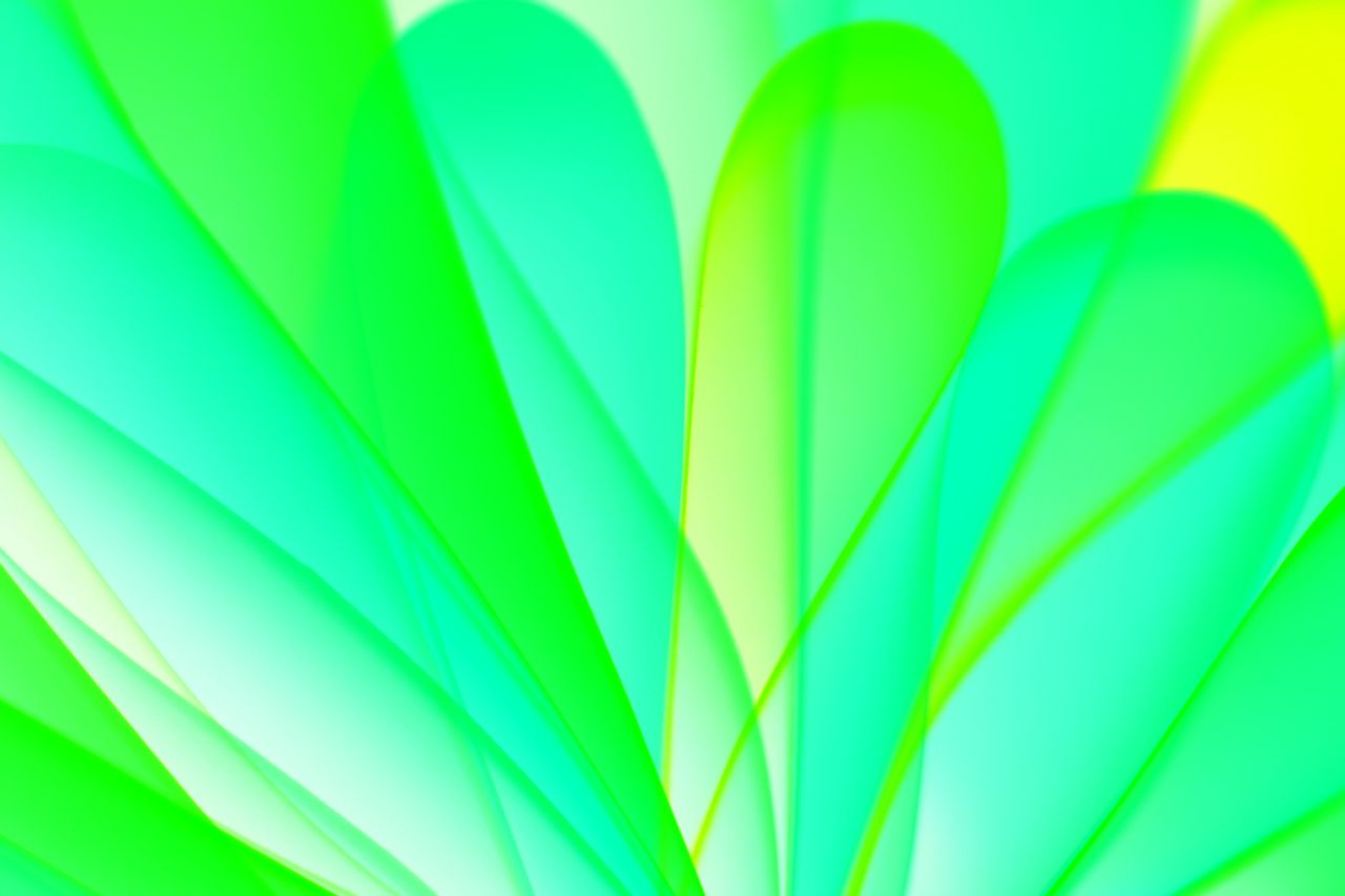 abstract image featuring a vibrant pattern of green and yellow overlap
