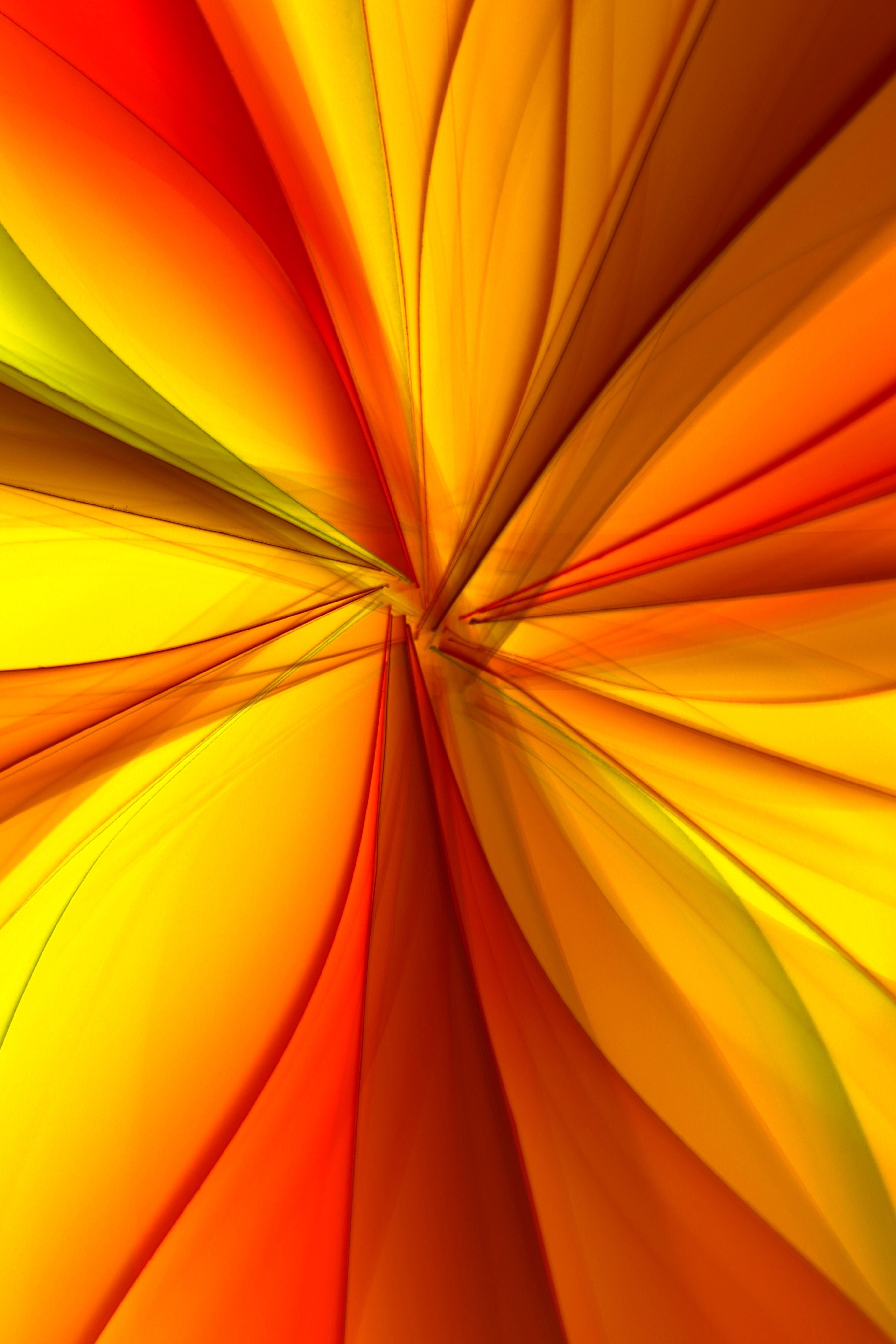 Dynamic abstract design featuring vibrant orange and yellow hues creating a sense of movement.