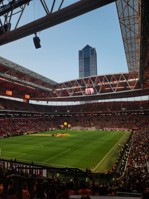 Free Packed Istanbul stadium during an exciting football match at twilight. Stock Photo